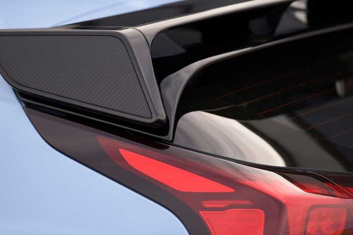 Close-up shot of the rear spoiler on the roof of a blue 2022 Hyundai Veloster N.